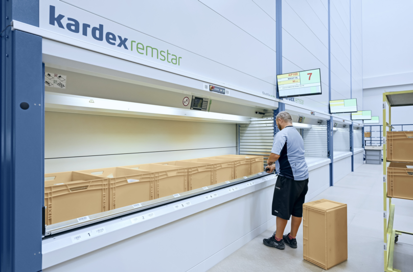 Warehouse worker using a kardex shuttle